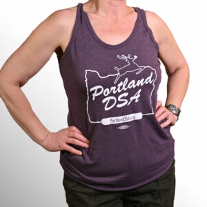 light plum-colored tank top with White Stag sign design saying "Portland DSA"