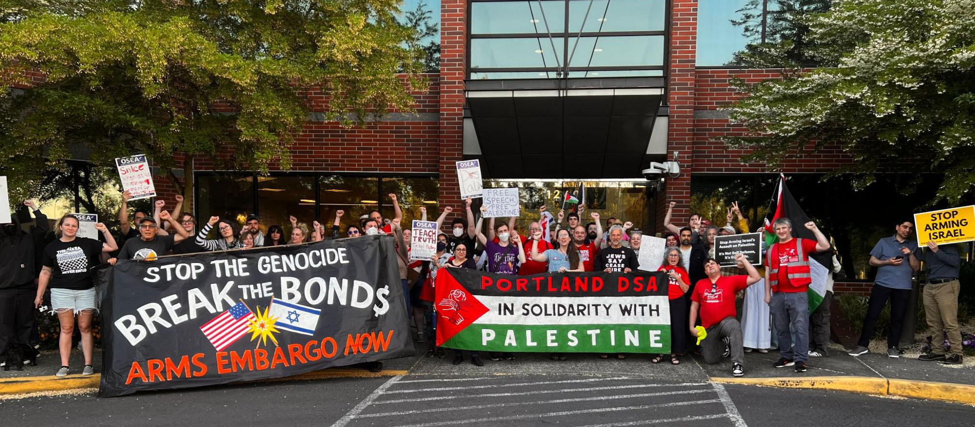 About 50 of the 150 supporters who rallied outside the Beaverton School Board headquarters, holding signs calling for arms embargo and solidarity with Palestine.