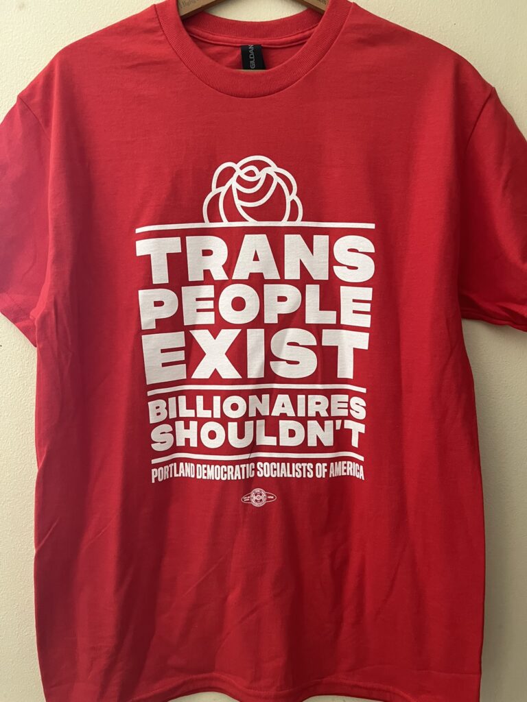 red tshirt that says "trans people exist, billionaires shouldn't"